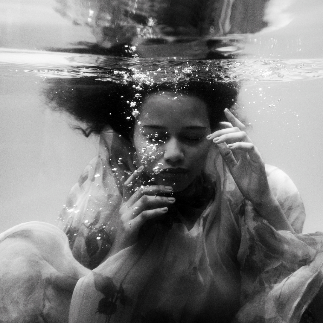 Girl with her eyes closed Holding her breath underwater