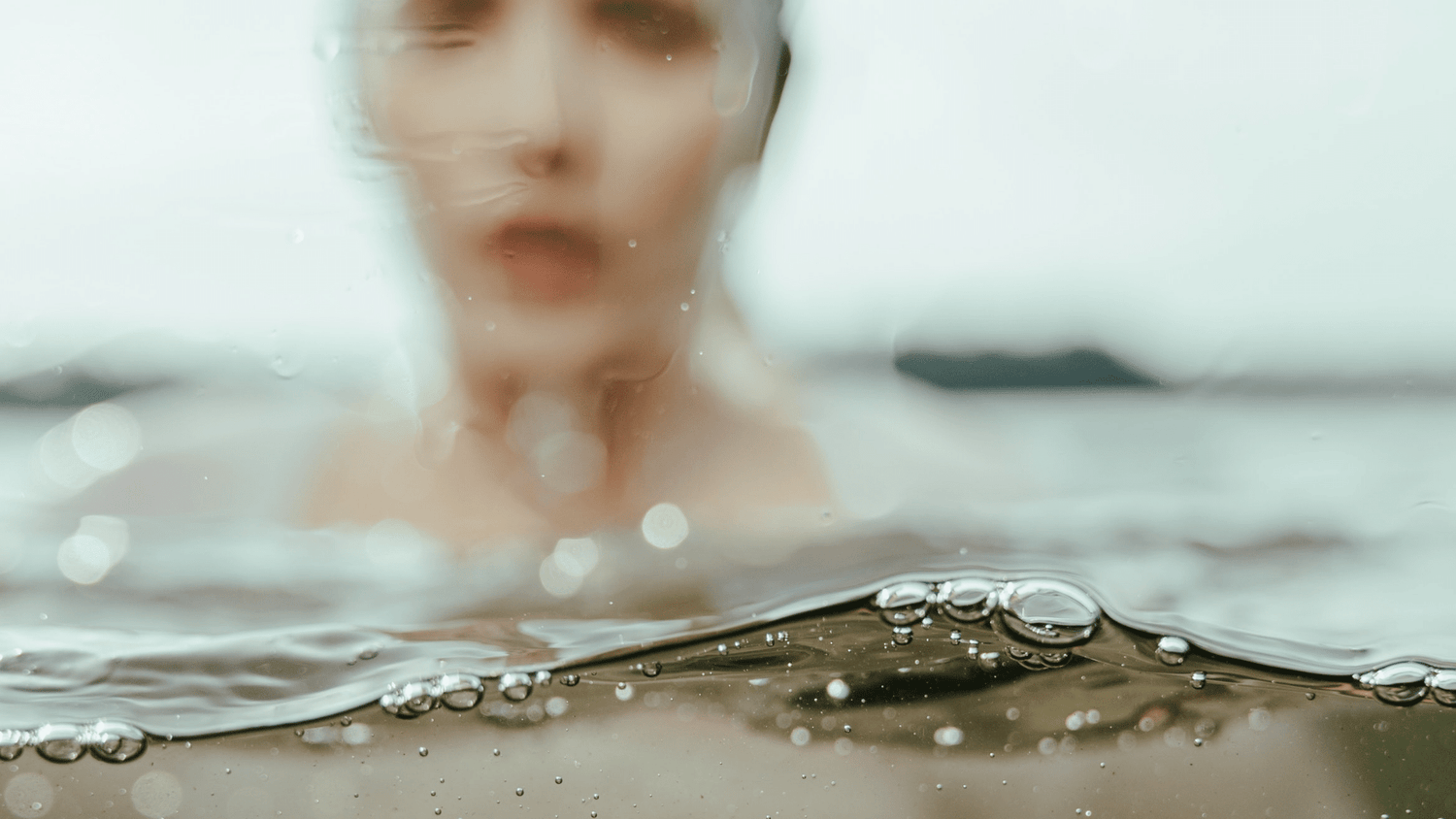 Woman swimming in fresh water